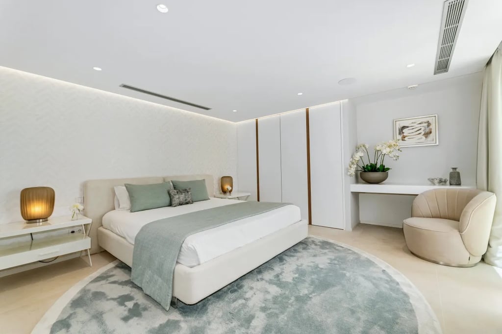 Stylish bedroom at Villa Serenity with soft neutral palette