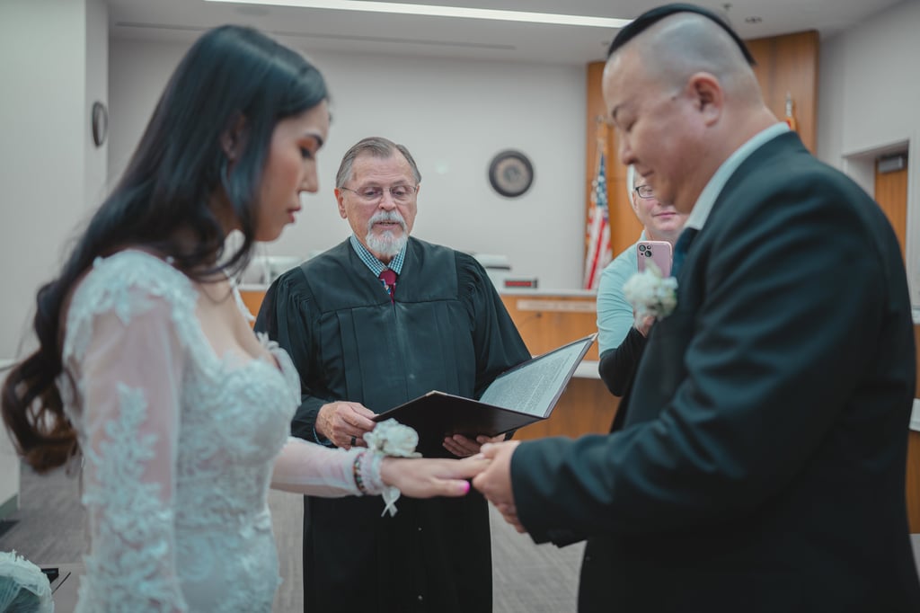 a man and woman getting married in a courtroom
