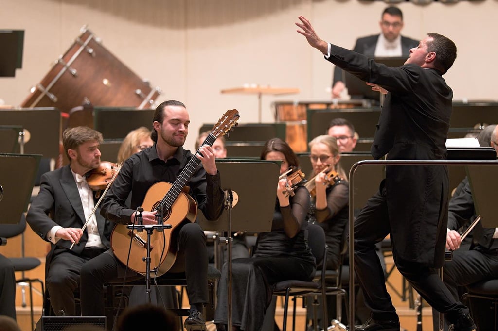 Classical guitarist Filip Babic playing with an orchestra