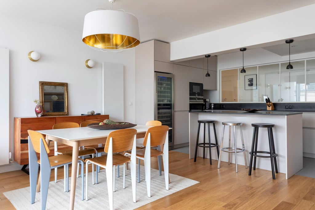 a dining room with a table and chairs