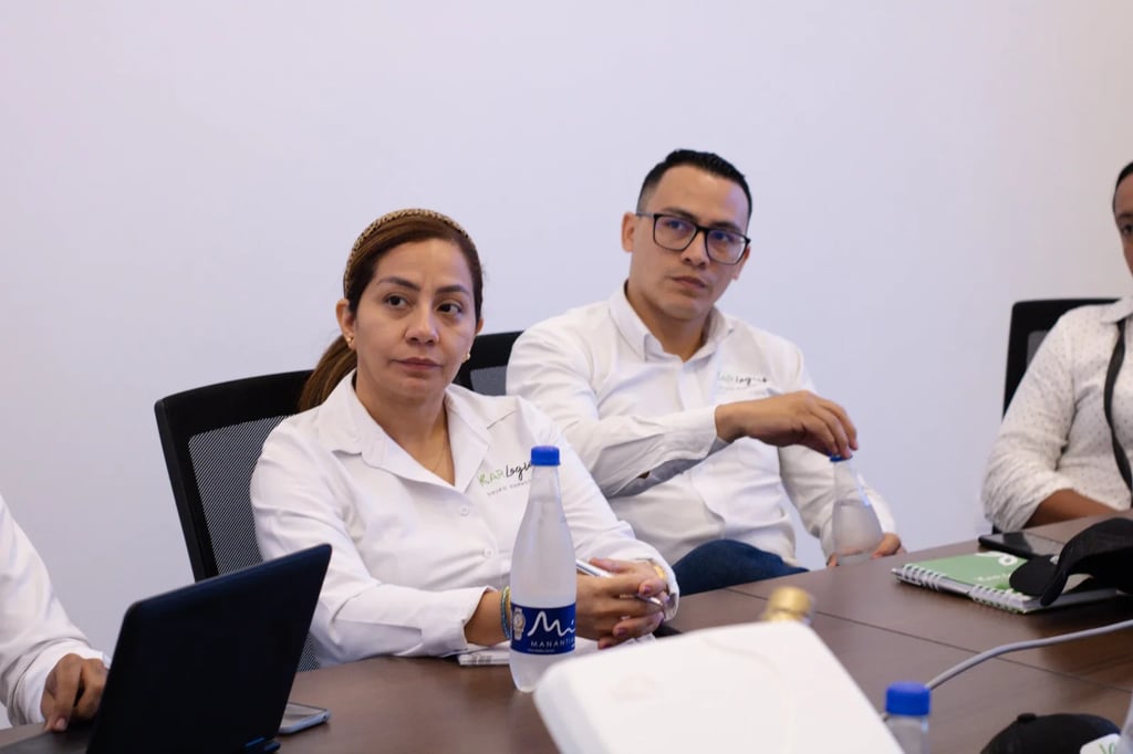 a group of people sitting around a table