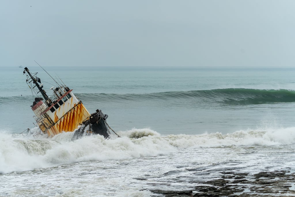 shipwreck with wave about to roll on the back