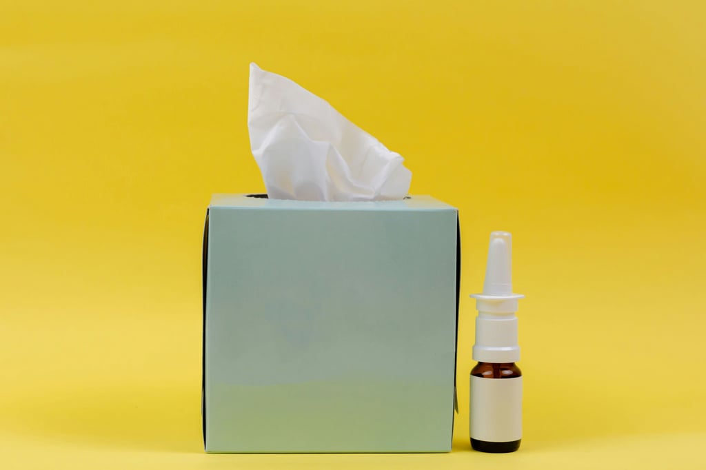 a tissue box with a tissue paper towel and a bottle of essential oils