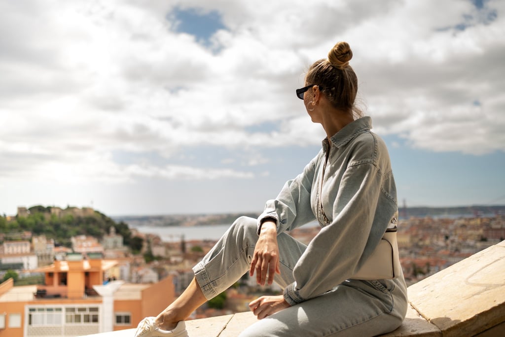 Female traveler enjoying sea view in Lisbon