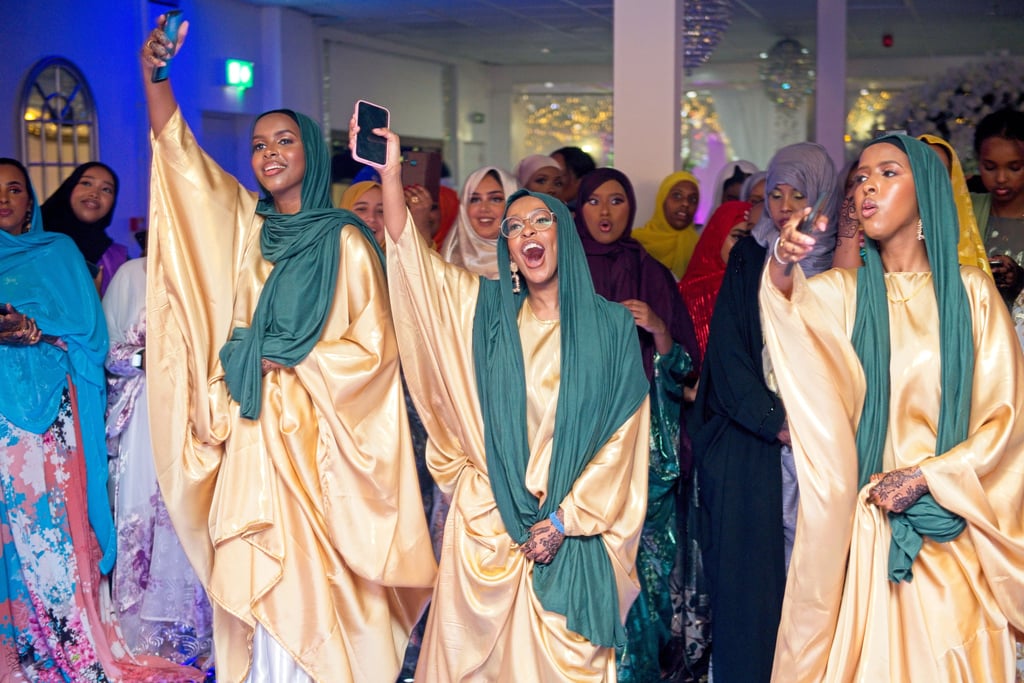 Somalian bridesmaids dancing, having a good time, wearing traditional clothes 