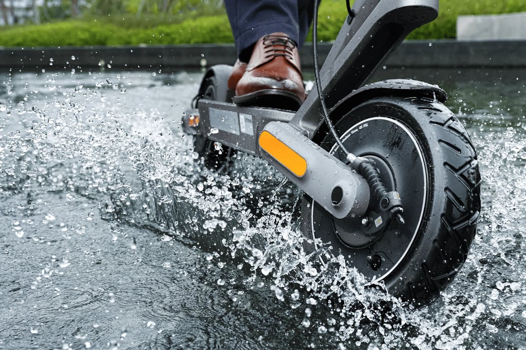 a person riding a scooter in the water