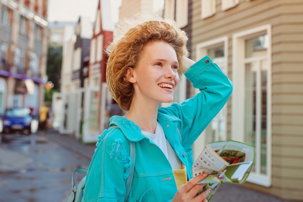 Solo female traveler enjoying city walk in Iceland
