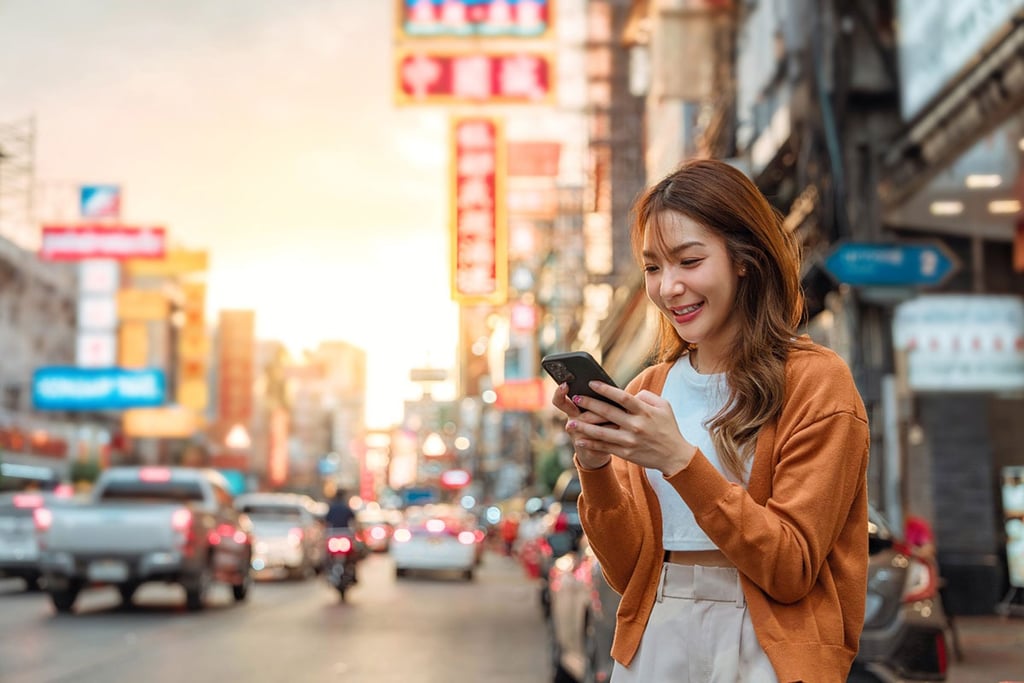 Asian girl using mobile phone in Asia