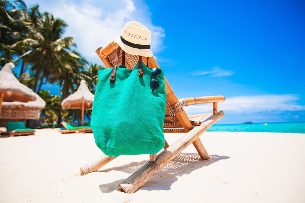 Beach chair with towel and beach bag at a tropical resort beach in the Dominican Republic