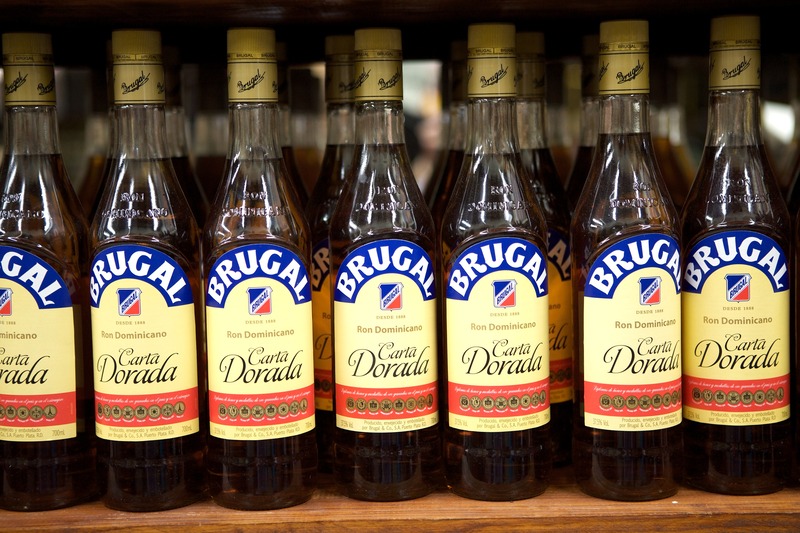 Brugal Carta Dorada Dominican rum bottles displayed on a local store shelf