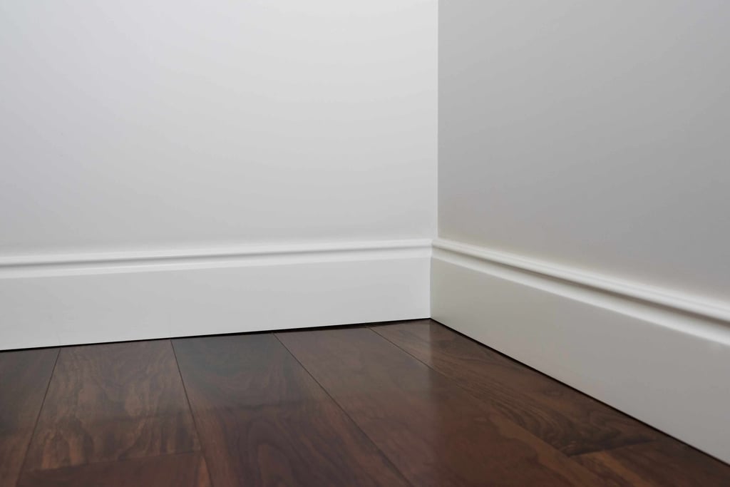 Clean baseboard corner installation with professional finish.