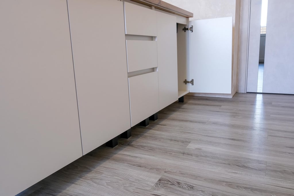 Laminate wood-look flooring installed in a modern kitchen.