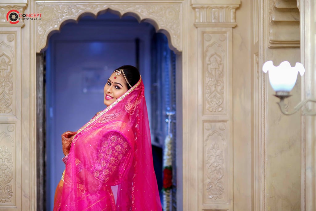 a woman in a pink sari, wedding photography