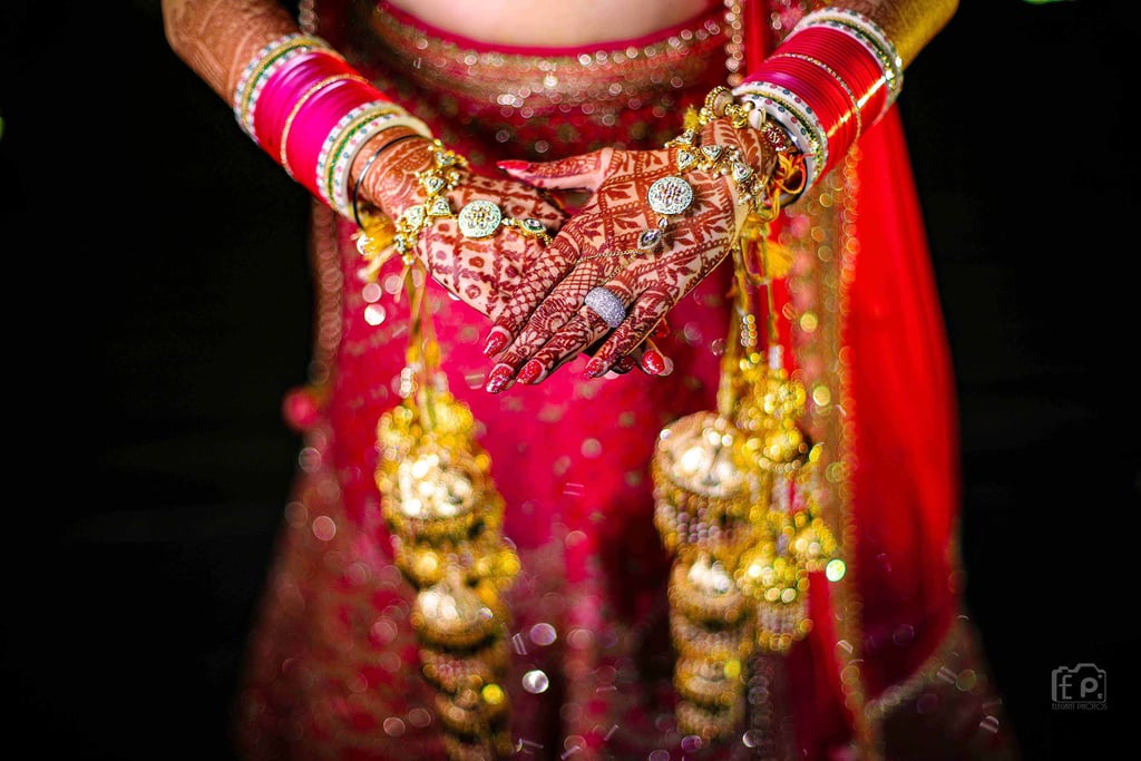 Close-up bridal mehndi and jewellery photography during a wedding