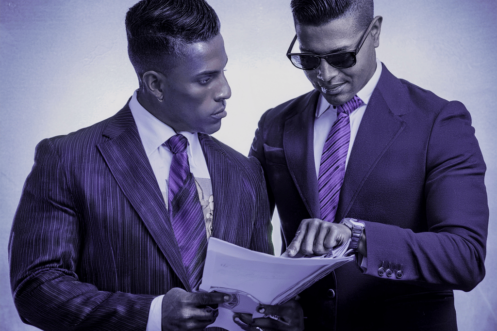 Two businessmen discussing a document