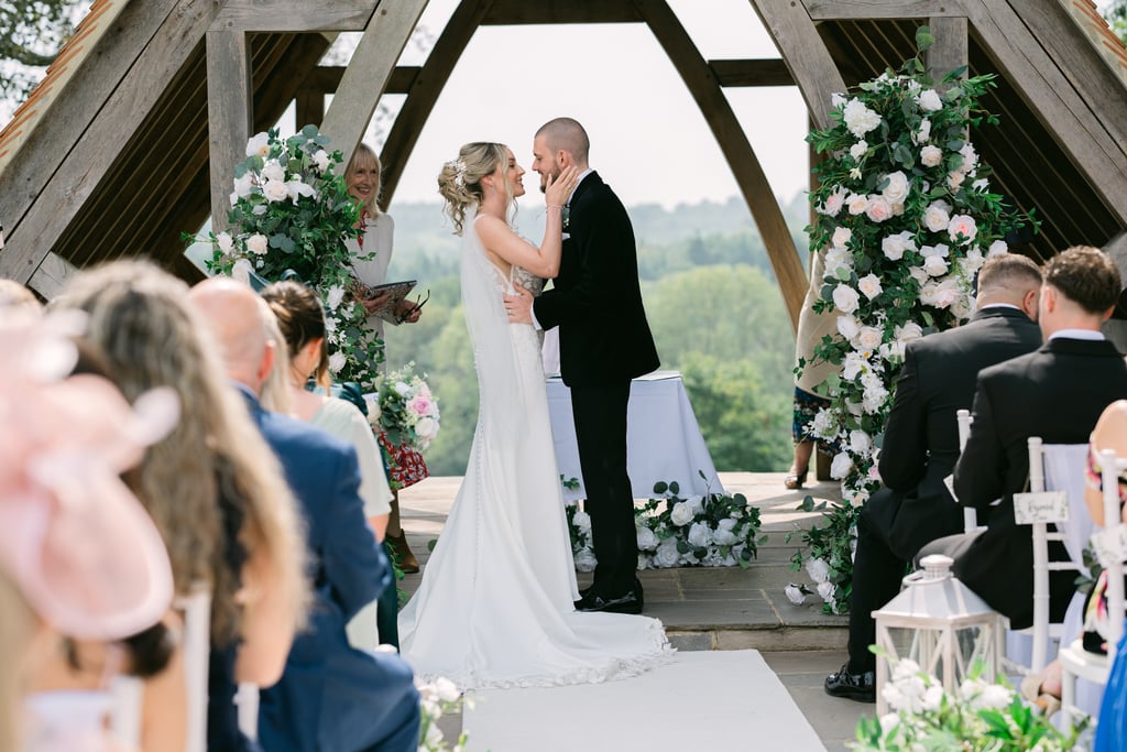 Couple at the altar during their wedding at Highley Manor, West Sussex