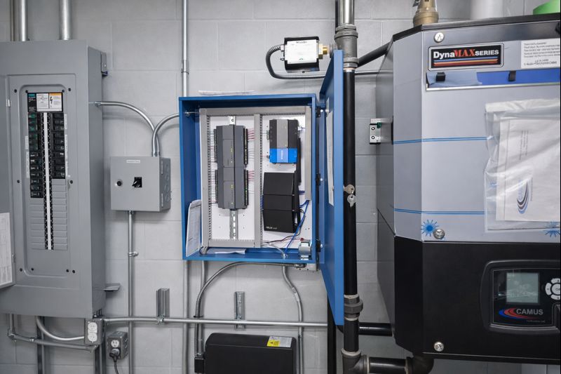 Building automation system panel installed next to a DynaMax boiler 