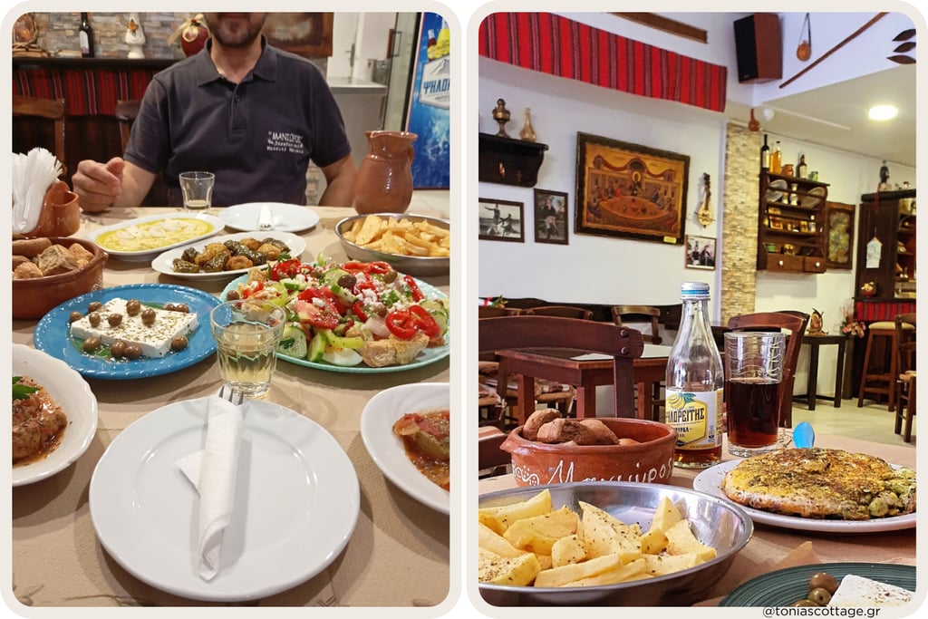 A spread of traditional Cretan dishes on the table at a rustic local taverna in Crete.