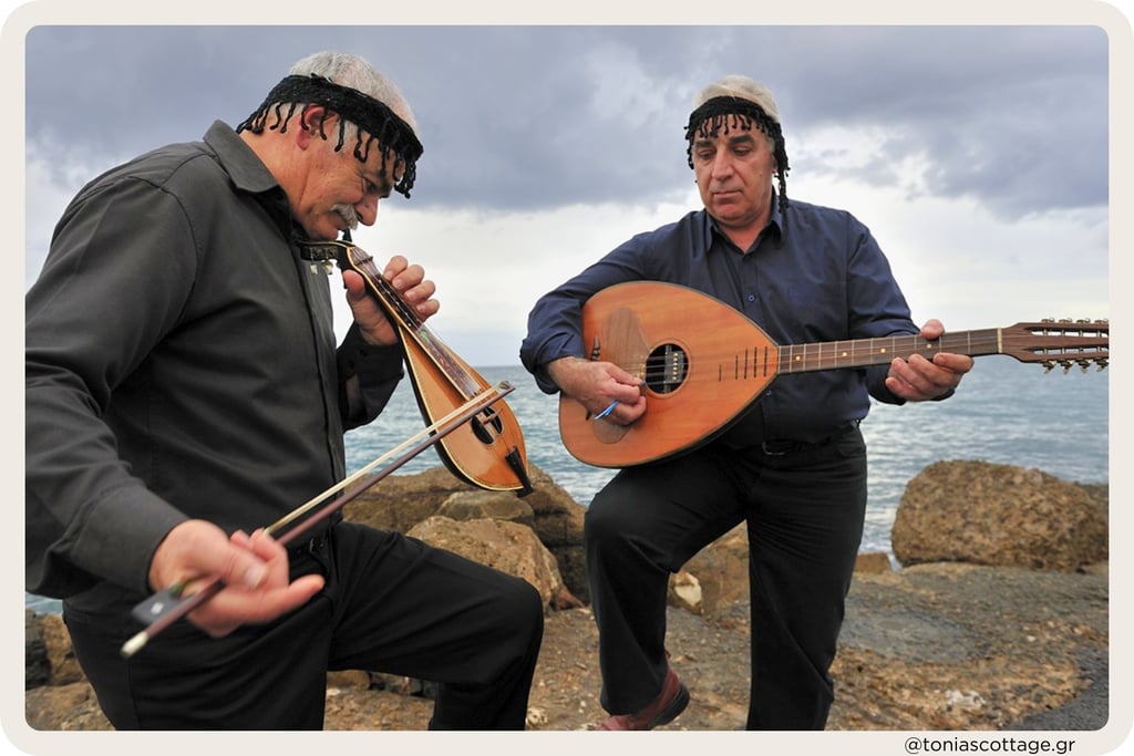 Two men playing traditional Cretan music outdoors