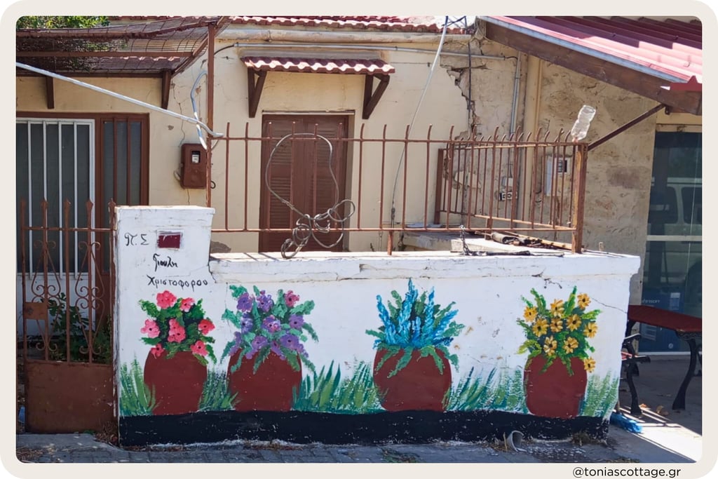 Flowering tree mural and painted pots, Crete local village artistry