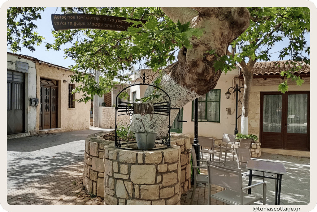 Alagni Village main square featuring the Platanus tree and traditional stone well