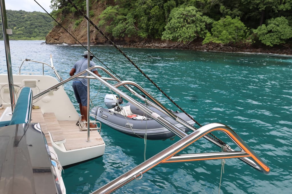 Kephas catamaran anchored in pristine turquoise bay during private tour in Papagayo