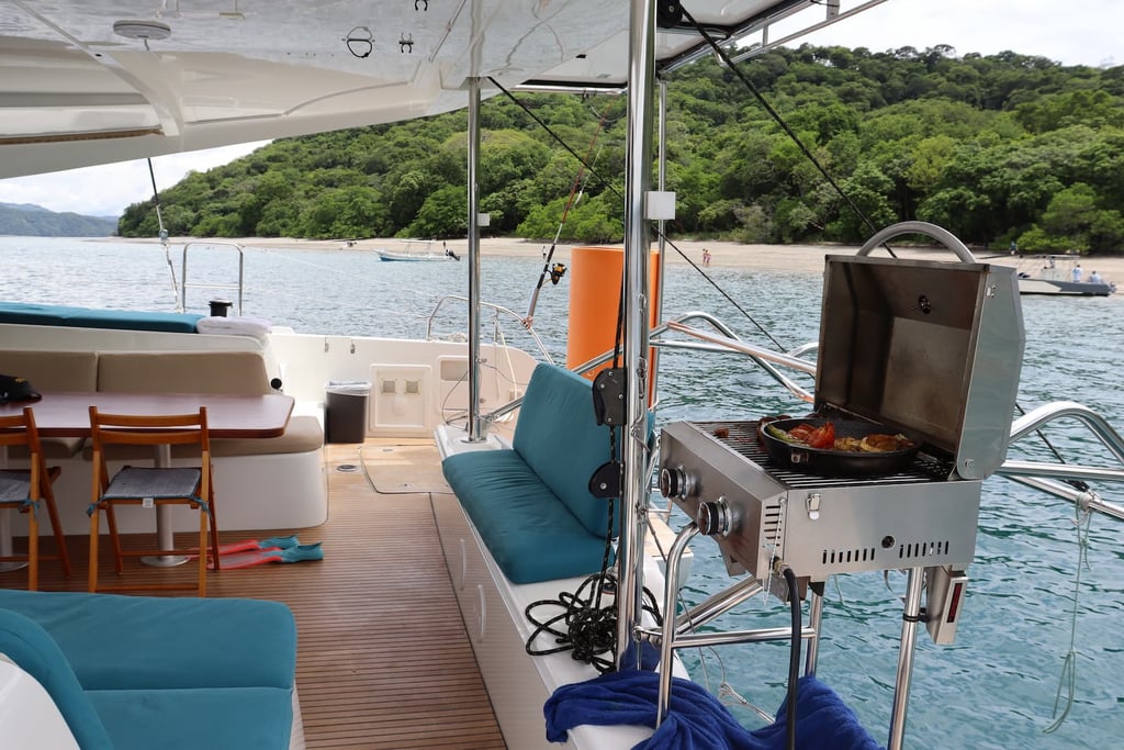 Fully equipped onboard kitchen where private chef prepares gourmet meals during catamaran tour Guanacaste