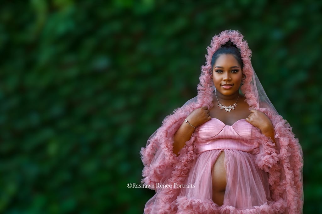 a woman in a pink Maternity dress