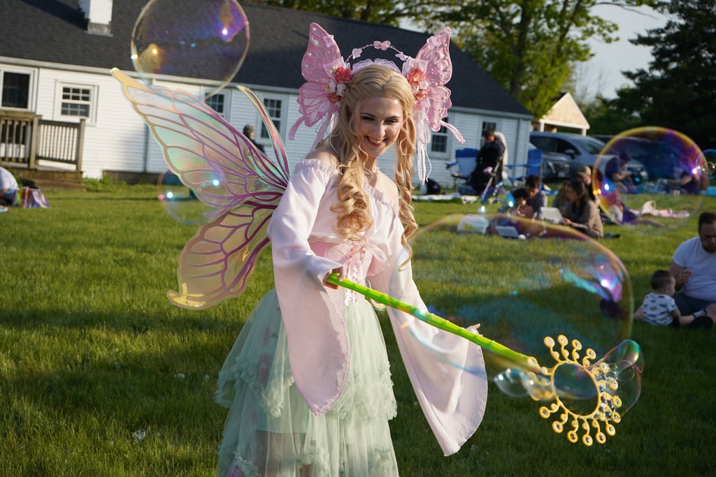 Bubble fairy smiling making bubbles