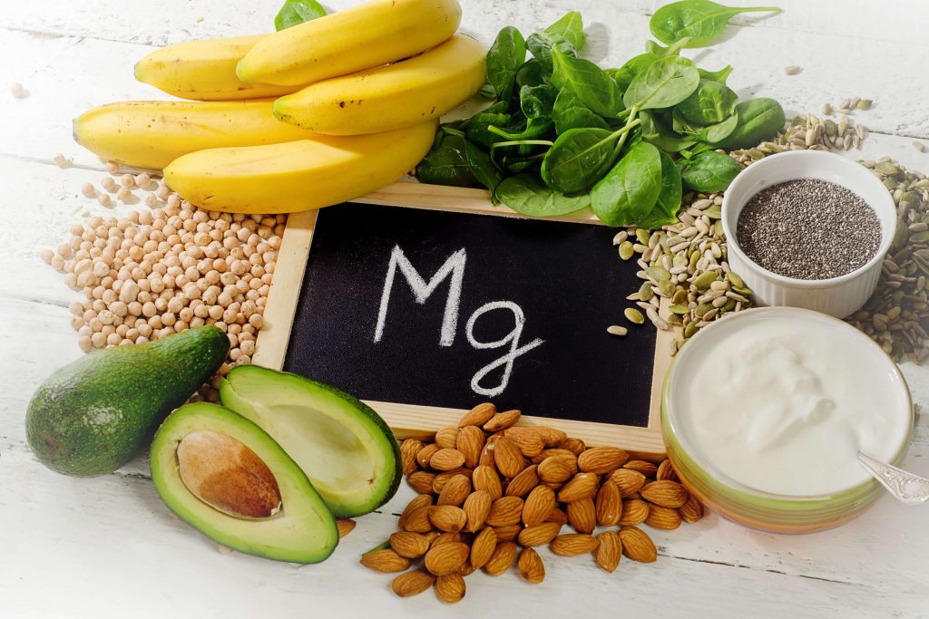 Magnesium-rich foods like leafy greens, nuts, and seeds, showcasing the health benefits of magnesium