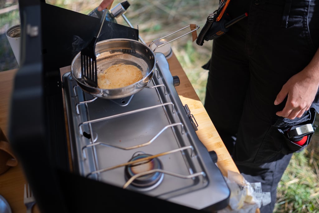 Cooking pancakes on a camp stove