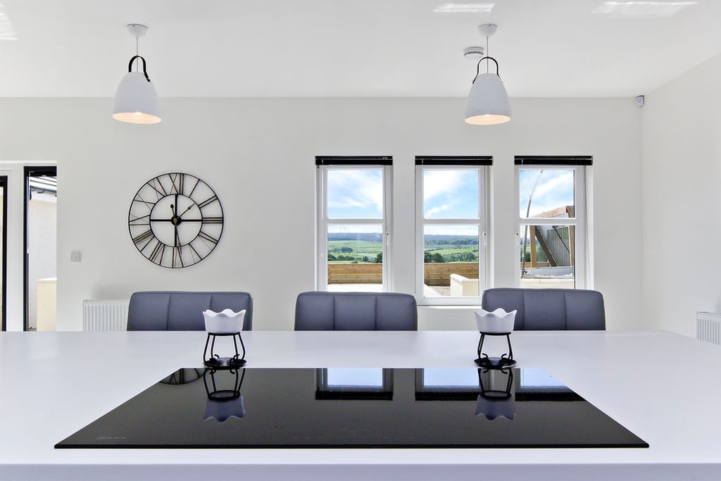 Modern kitchen design with integrated appliances  and a spacious island.