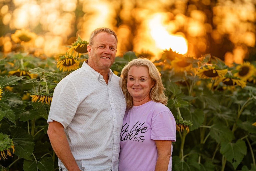 A couple at Walker Ranch's sunflower festival