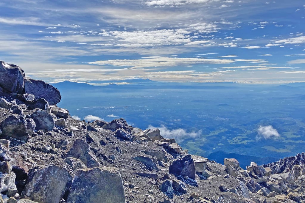 The volcanoes Malinche and Pico de Orizaba on the Distant Horizon, seen from Iztacchuatl, Mexico