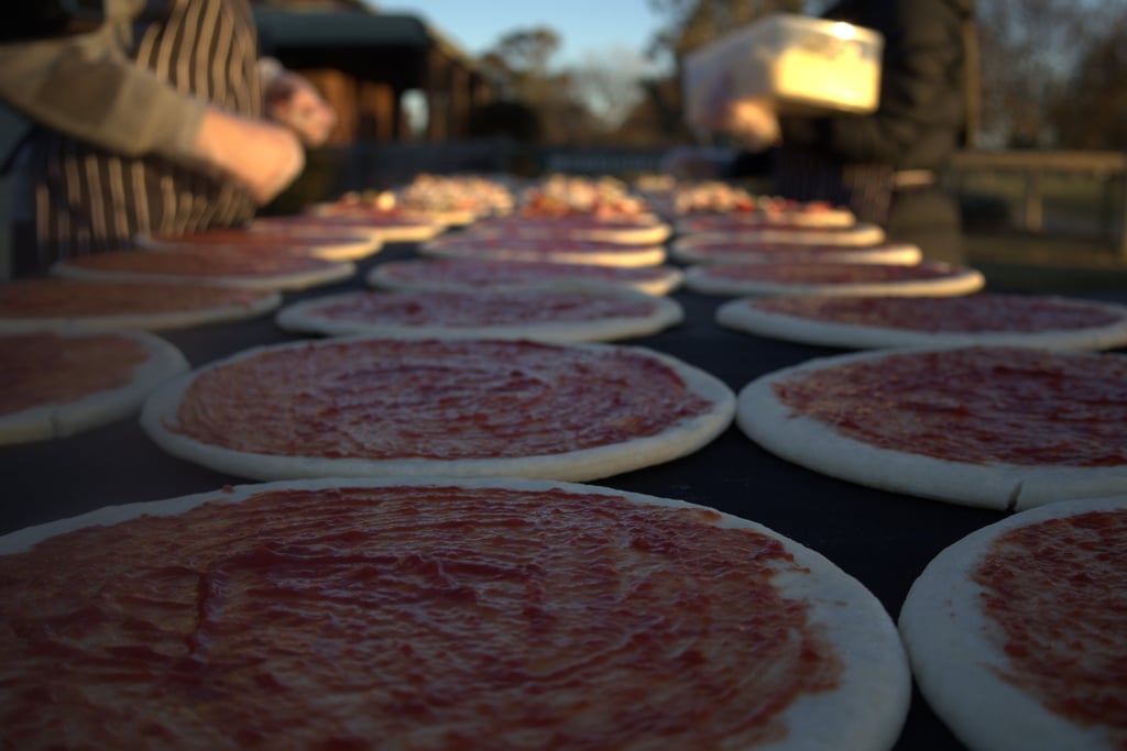 Pizzas being prepared on a table at a party in country Victoria