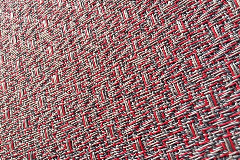 a close up of a red and white woven fabric with a red and white background