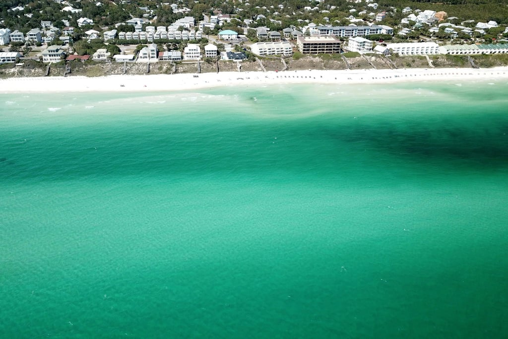 a beach with a boat in the water