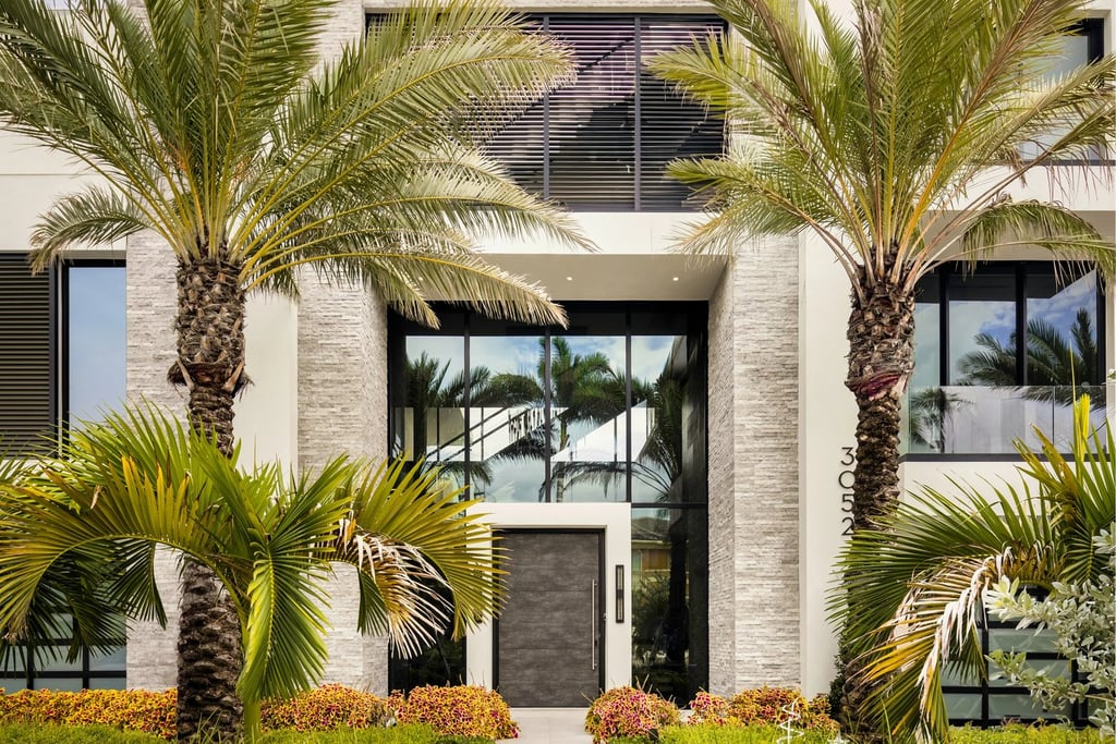 a house with a large front yard and a walkway