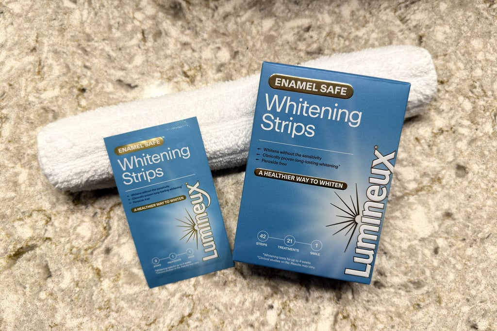 Flat lay of whitening strips and towel showing products for a brighter, healthy smile