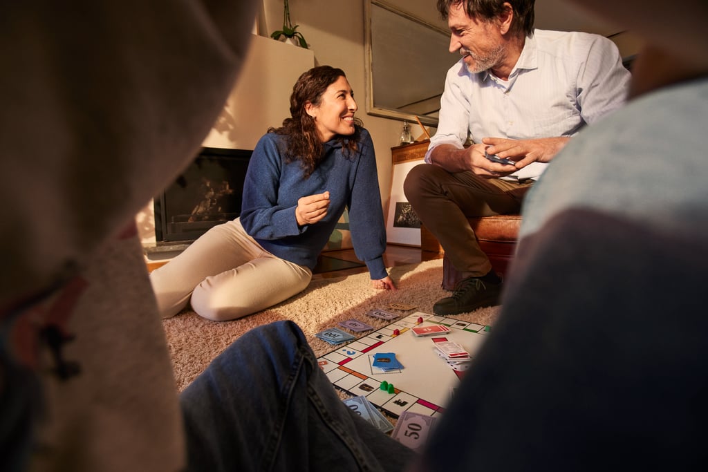 a man and woman playing a board game