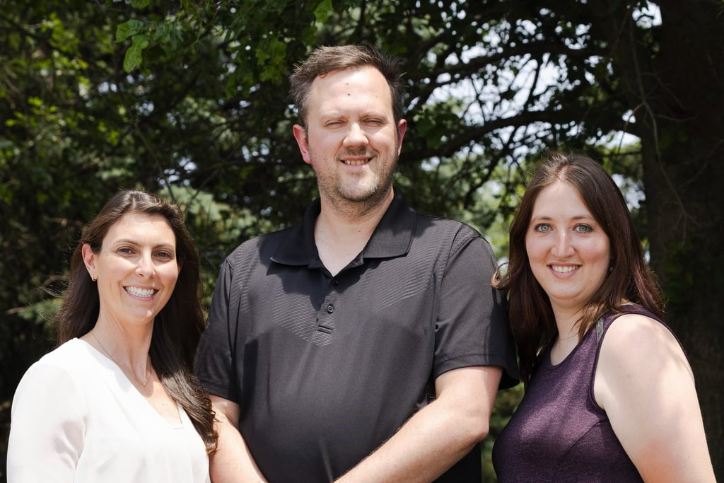 3 therapists looking toward the camera