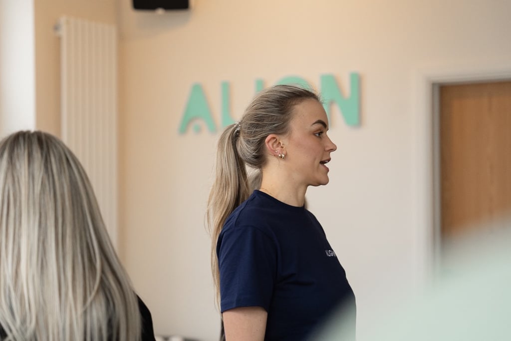 woman with ponytail talking