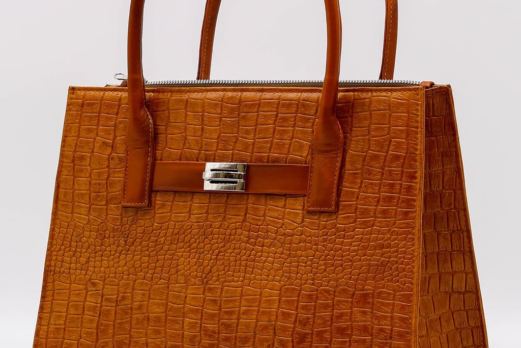 a brown leather handbag with a brown alligator skin by Heros Leather HN
