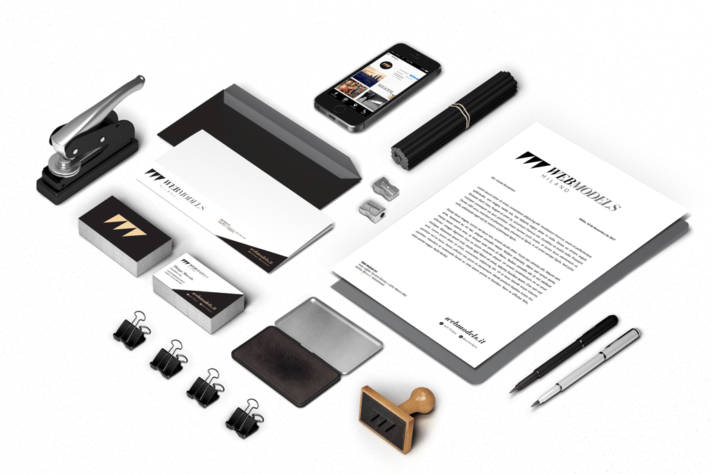 a variety of stationery items including a phone, pen and a pen