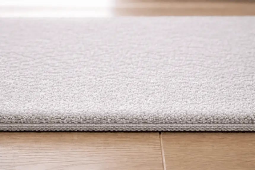 Low pile carpet with dense short fibers, smooth and durable