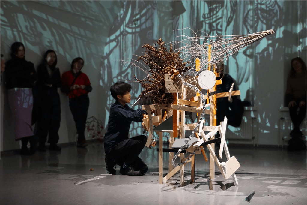 Audience viewing 'Assemble' ikebana performance-installation by Hedy Leung at HIAP Gallery