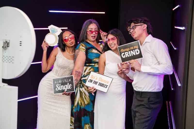 Vogue LED photo booth setup with neon lights at Sweet 16 party