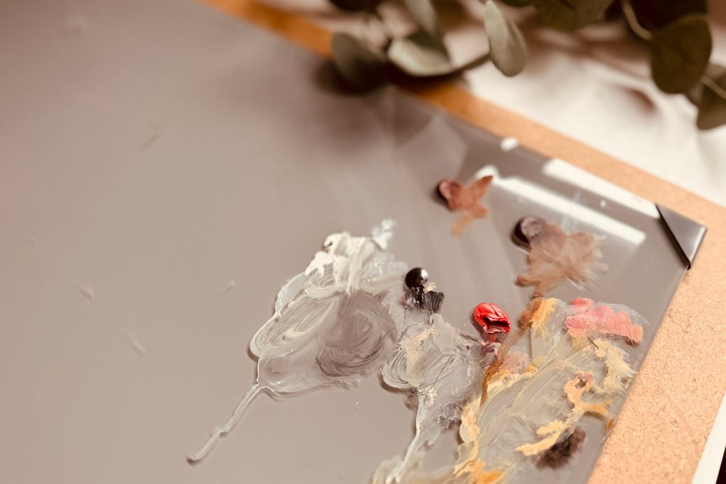 The grey glass palette I use in my painting process