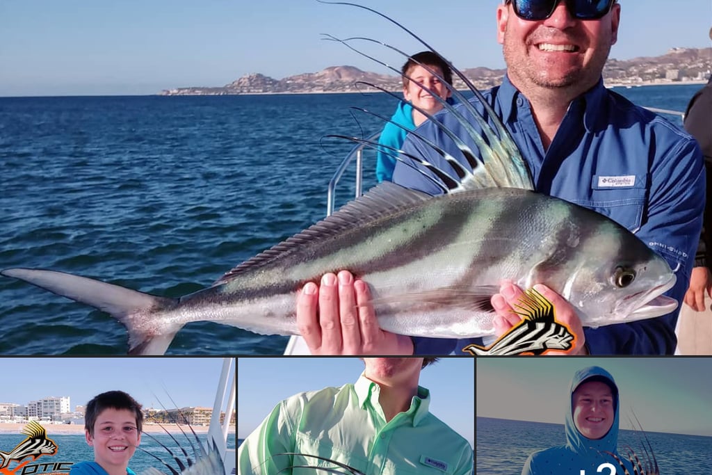 a man holding a fish fish on a boat