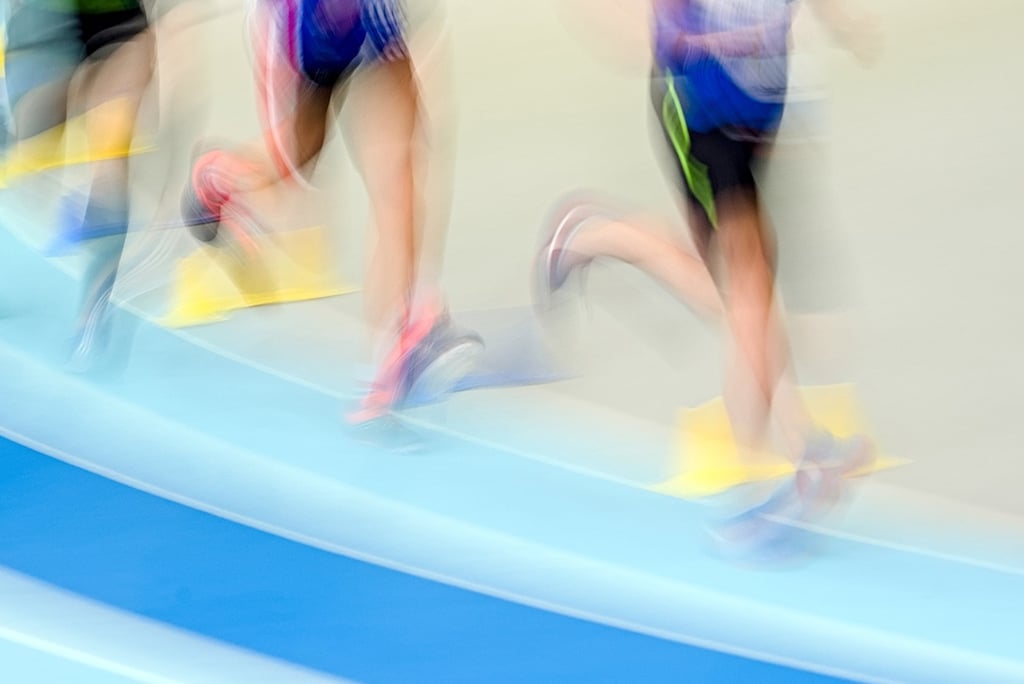 A group of people running on a track
